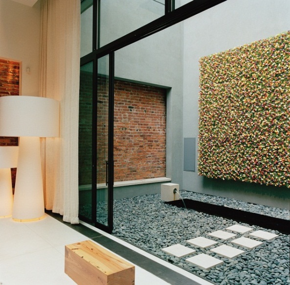The stunning colourful wall art that complements the exposed brick perfectly